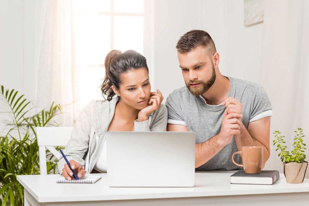 couple looking at laptop computer