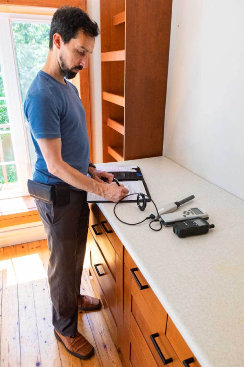 home inspector testing indoor air quality